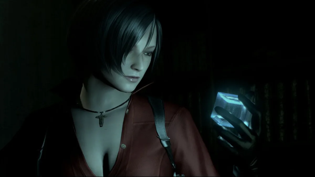 Ada Wong en chemisier rouge devant un écran lumineux dans Resident Evil 6
