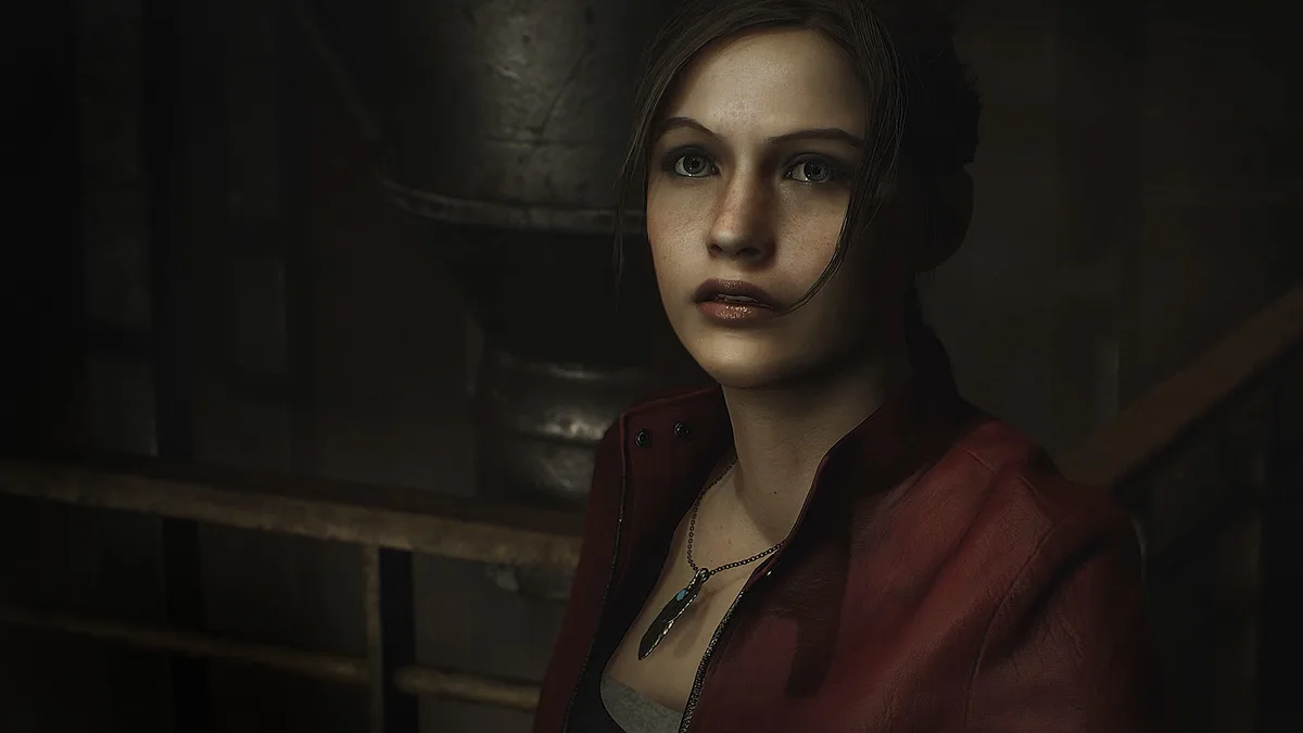 Claire Redfield en veste rouge dans un escalier sombre dans Resident Evil 2 (2019)